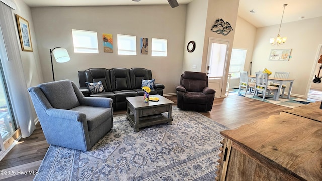 1905 Coleman Lake Dr, Calabash, NC 28467 - living area featuring wood finished floors, a chandelier, ceiling fan, baseboards, and high vaulted ceiling