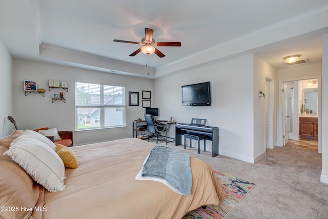 8603 Lanvale Forest Dr, Leland, NC 28451 - bedroom featuring a tray ceiling, an office area, crown molding, carpet floors, and baseboards