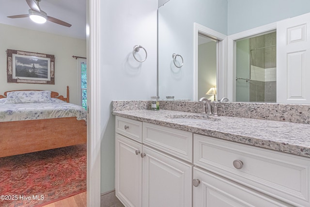 full bath with ensuite bathroom, a ceiling fan, and vanity