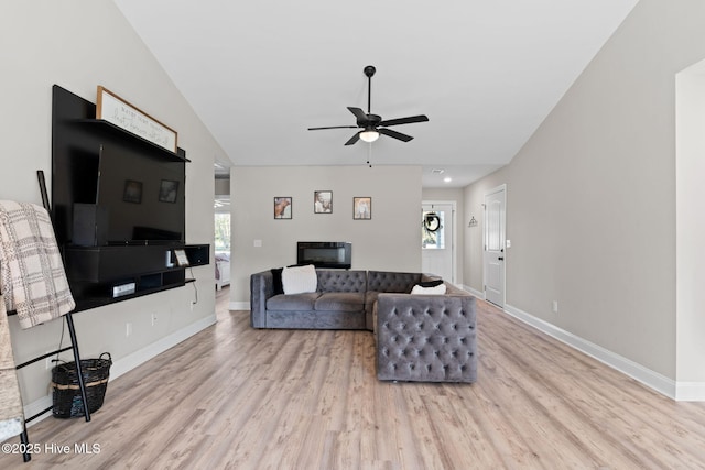 2665 Ash Little River Rd NW, Longwood, NC 28452 - living room with ceiling fan, wood finished floors, baseboards, and vaulted ceiling