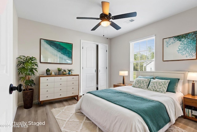2665 Ash Little River Rd NW, Longwood, NC 28452 - bedroom with wood finished floors, a ceiling fan, a closet, and baseboards