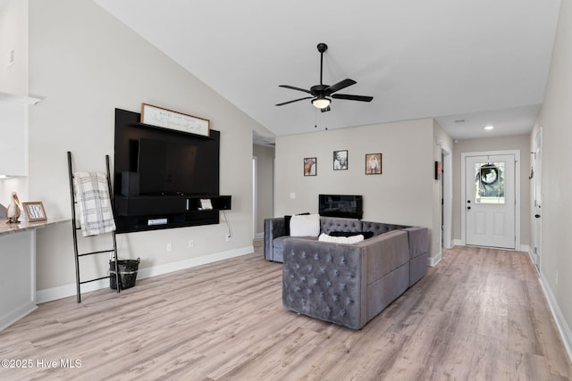 2665 Ash Little River Rd NW, Longwood, NC 28452 - living room with wood finished floors, ceiling fan, lofted ceiling, and baseboards