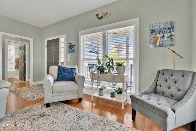 334 NE 48th St, Oak Island, NC 28465 - sitting room with wood finished floors and baseboards