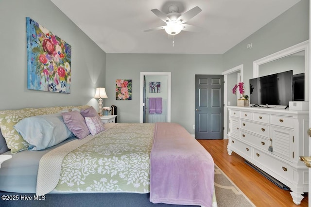 334 NE 48th St, Oak Island, NC 28465 - bedroom with light wood-type flooring and a ceiling fan