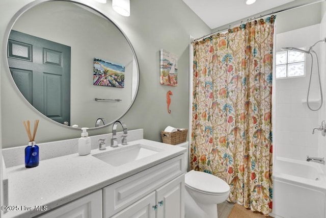 334 NE 48th St, Oak Island, NC 28465 - bathroom featuring vanity, toilet, and shower / bath combo