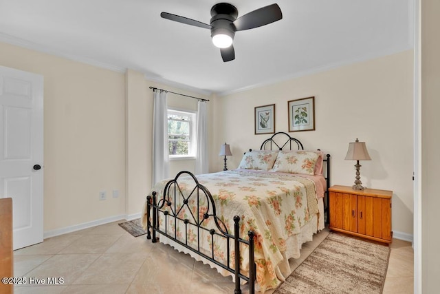 334 NE 48th St, Oak Island, NC 28465 - bedroom featuring light tile patterned flooring, crown molding, a ceiling fan, and baseboards