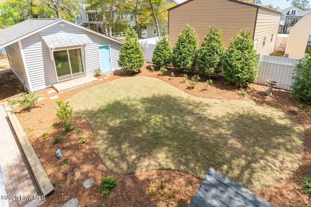 334 NE 48th St, Oak Island, NC 28465 - view of yard with an outbuilding