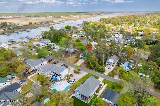334 NE 48th St, Oak Island, NC 28465 - aerial overview of property's location featuring a nearby body of water and nearby suburban area