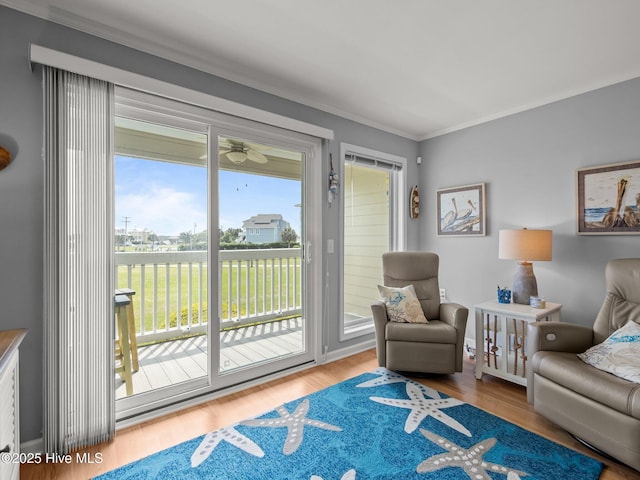 650 Cedar Point Blvd Unit B14, Cedar Point, NC 28584 - sitting room with crown molding, a ceiling fan, and wood finished floors