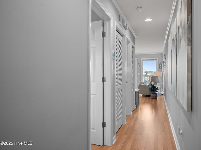 650 Cedar Point Blvd Unit B14, Cedar Point, NC 28584 - hall with light wood-style flooring, baseboards, and ornamental molding