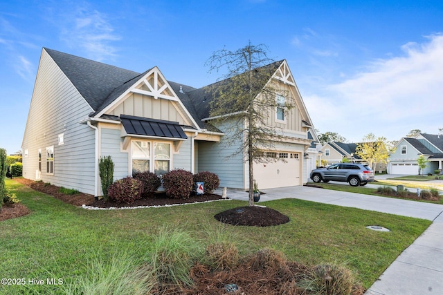 view of front of property featuring board and batten siding, an attached garage, a front lawn, and concrete driveway