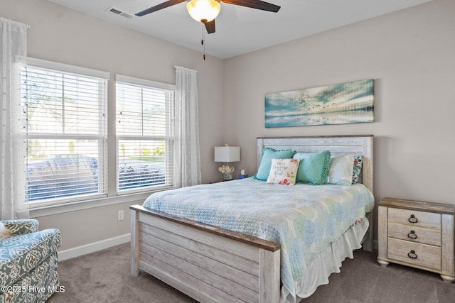 bedroom with visible vents, carpet flooring, baseboards, and a ceiling fan