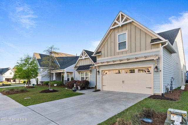 craftsman-style home featuring driveway, a front yard, board and batten siding, and a garage
