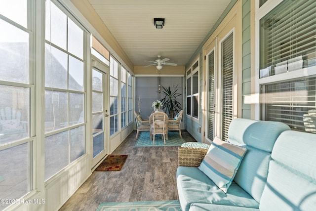 sunroom / solarium featuring french doors and a ceiling fan