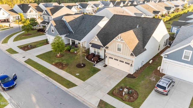 birds eye view of property with a residential view