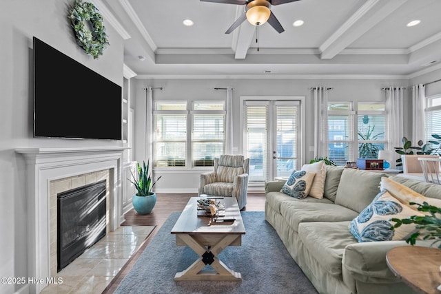 living area with a ceiling fan, recessed lighting, and ornamental molding