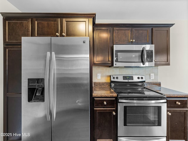 kitchen with dark stone countertops, backsplash, dark brown cabinets, and appliances with stainless steel finishes