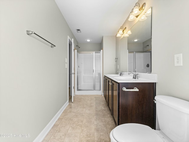 full bath with vanity, baseboards, toilet, a shower stall, and visible vents
