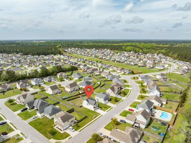 birds eye view of property with a residential view