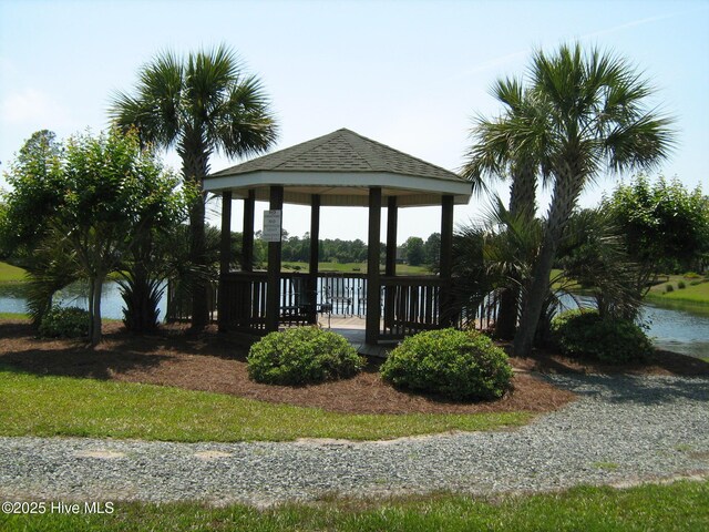 view of home's community with a gazebo and a water view