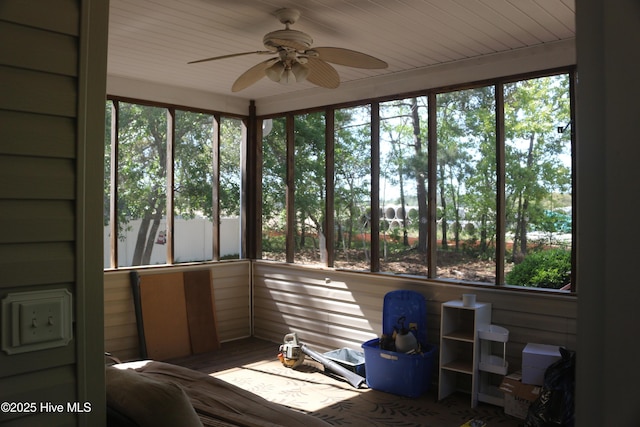 sunroom with a wealth of natural light and ceiling fan