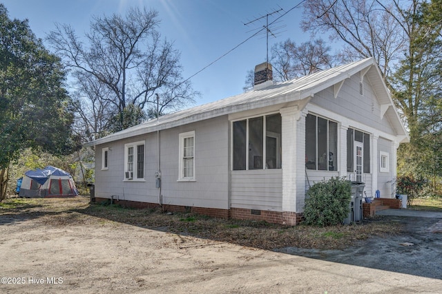 257 E Raleigh Blvd, Rocky Mount, NC 27801 - view of property exterior featuring an outdoor structure, crawl space, and a chimney