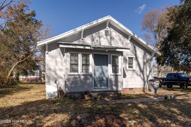 257 E Raleigh Blvd, Rocky Mount, NC 27801 - view of front of home with entry steps, crawl space, and a front lawn