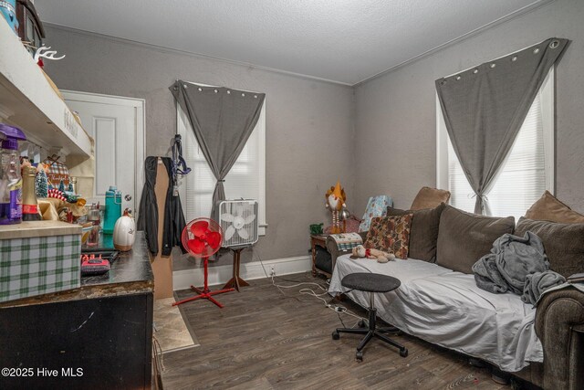 257 E Raleigh Blvd, Rocky Mount, NC 27801 - bedroom featuring a textured ceiling, baseboards, and wood finished floors