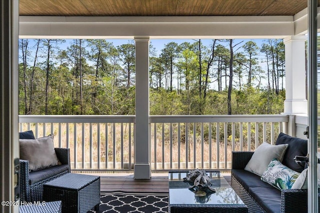 sunroom / solarium featuring an outdoor hangout area