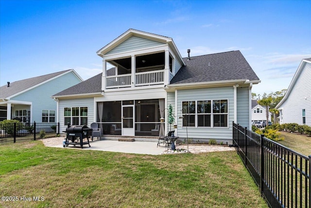 back of property featuring a sunroom, a fenced backyard, a lawn, a patio area, and a balcony