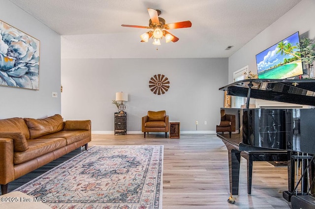 301 Softwood Ct, Jacksonville, NC 28540 - living area with visible vents, baseboards, ceiling fan, a textured ceiling, and wood finished floors