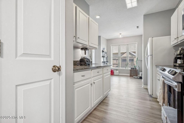 301 Softwood Ct, Jacksonville, NC 28540 - kitchen featuring light wood-style floors, white cabinets, and electric stove