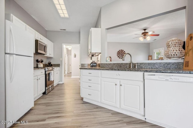 301 Softwood Ct, Jacksonville, NC 28540 - kitchen with white cabinets, a sink, ceiling fan, light wood-style floors, and stainless steel appliances