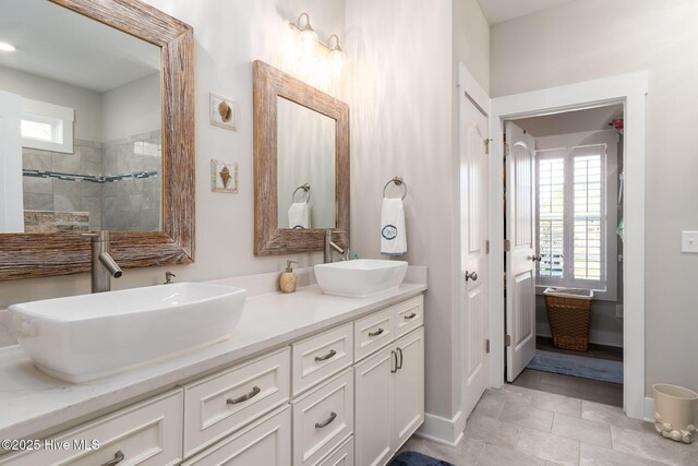 913 Wetherington Landing Rd, Stella, NC 28582 - full bath with a sink, a wealth of natural light, and double vanity