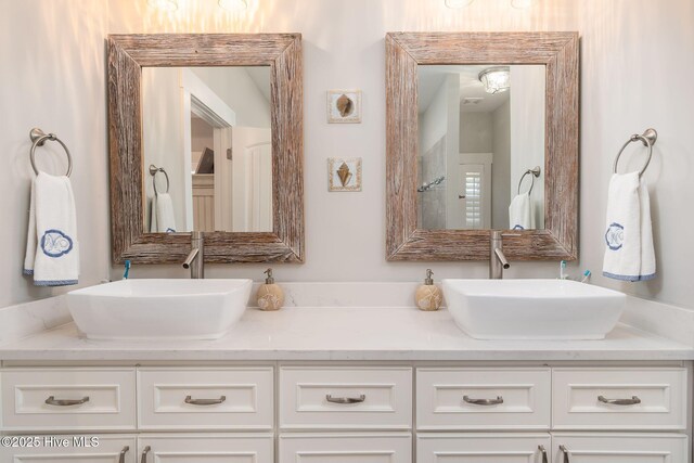 913 Wetherington Landing Rd, Stella, NC 28582 - bathroom featuring double vanity and a sink