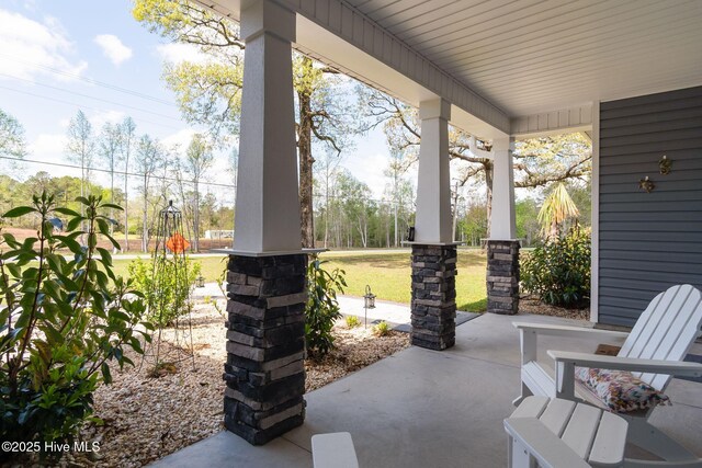 913 Wetherington Landing Rd, Stella, NC 28582 - view of patio featuring covered porch