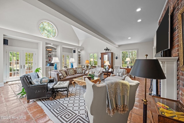 living room featuring recessed lighting, vaulted ceiling, built in features, and french doors