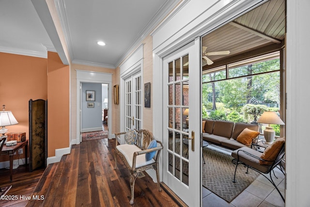 entryway featuring crown molding, baseboards, ceiling fan, hardwood / wood-style flooring, and french doors