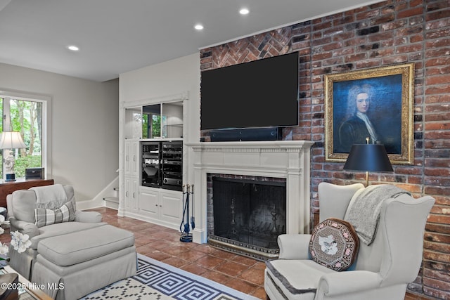 tiled living area featuring recessed lighting, a wealth of natural light, and a fireplace