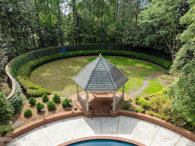 view of swimming pool with a yard, a gazebo, and a patio area