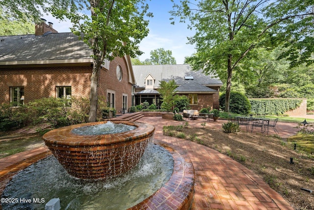 view of property's community featuring a patio