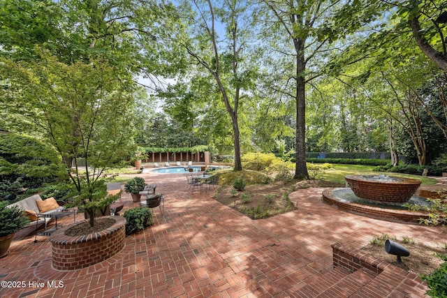 view of patio with an outdoor pool