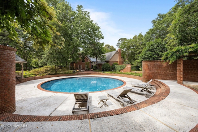 pool with a patio