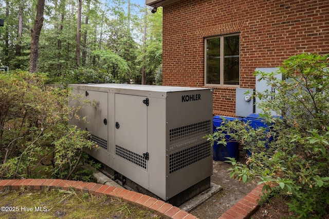 details with electric meter and brick siding