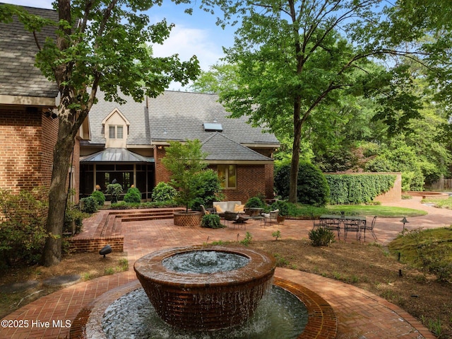 view of patio with a gazebo and an outdoor fire pit