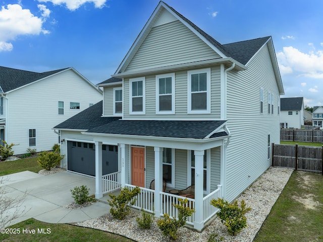 555 Heartwood Dr, Leland, NC 28479 - view of front of home featuring a shingled roof, a porch, a garage, fence, and driveway