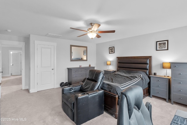 555 Heartwood Dr, Leland, NC 28479 - bedroom with light carpet, visible vents, and a ceiling fan