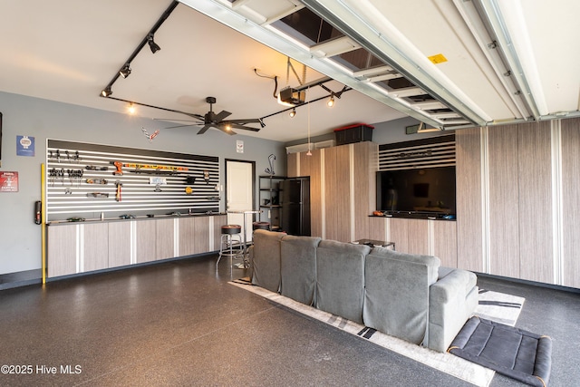 555 Heartwood Dr, Leland, NC 28479 - interior space featuring ceiling fan, rail lighting, and dark speckled floor