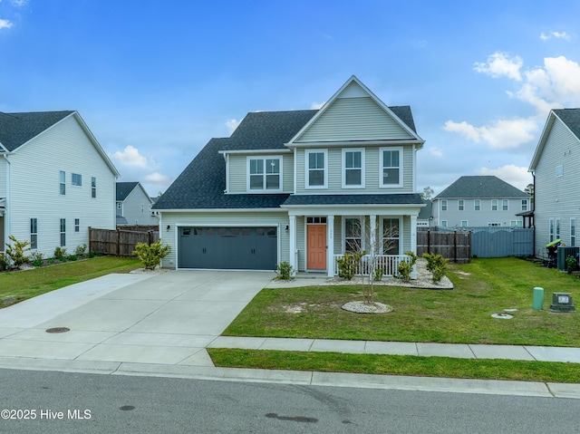 555 Heartwood Dr, Leland, NC 28479 - traditional-style home with driveway, a front yard, fence, and a garage