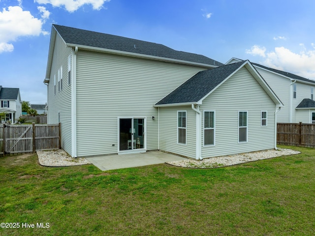 555 Heartwood Dr, Leland, NC 28479 - rear view of property featuring a yard, a patio area, and fence